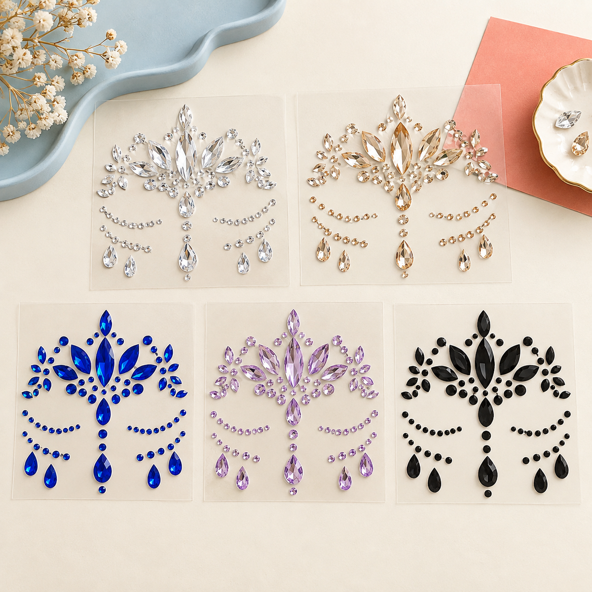 Five unbranded self-adhesive face gem sticker sheets in assorted colors