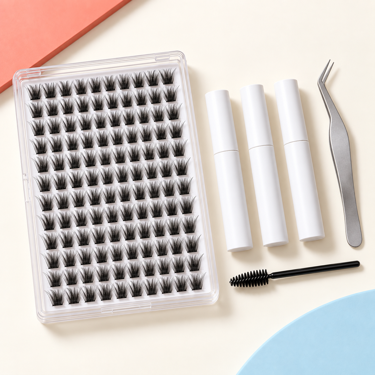 Wispy lash cluster kit with tray, three tubes, applicator and spoolie — overhead view