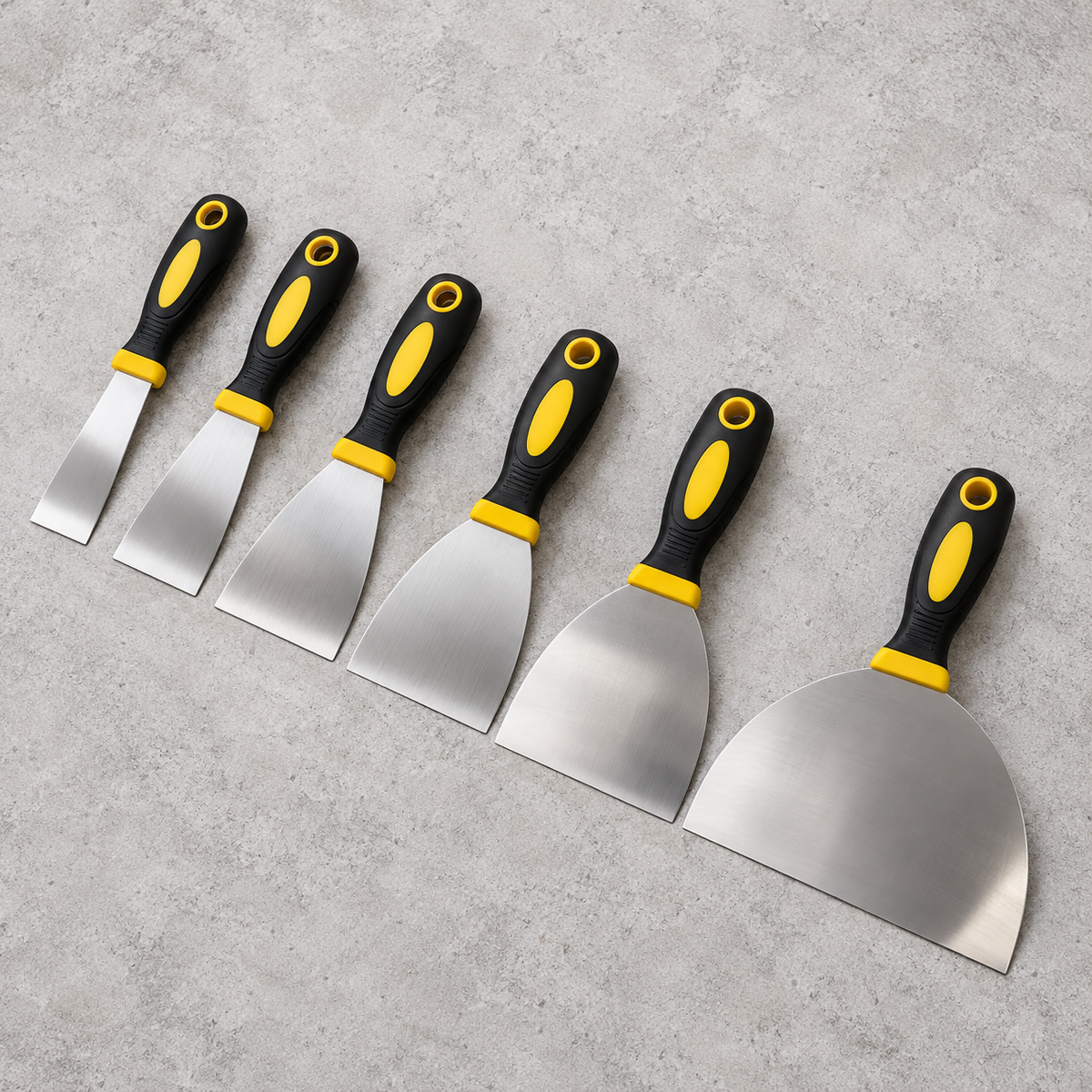 Six-piece stainless steel putty knife set — overhead flat lay
