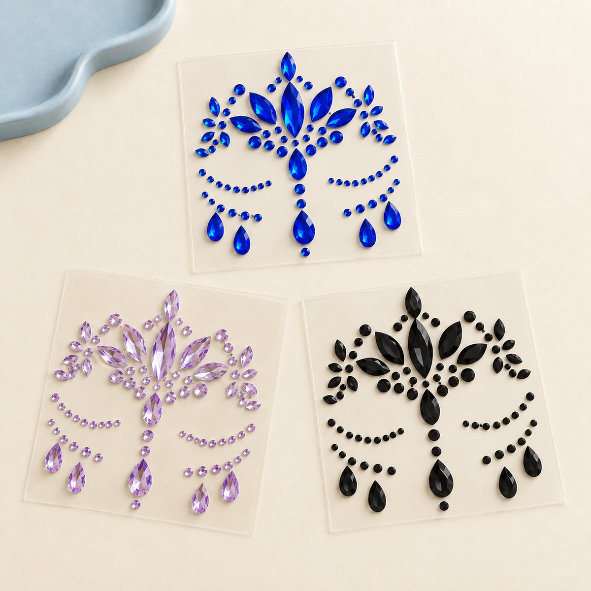 Blue, lavender and black gem sticker sheets — close-up detail